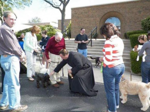 Fr. James Dokos blesses the animals in front of the Church of Saints Peter and Paul in Glenview.