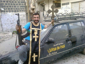  An Obama backed Terrorist, making sport of the loot from a Syrian Church that has been ransacked.